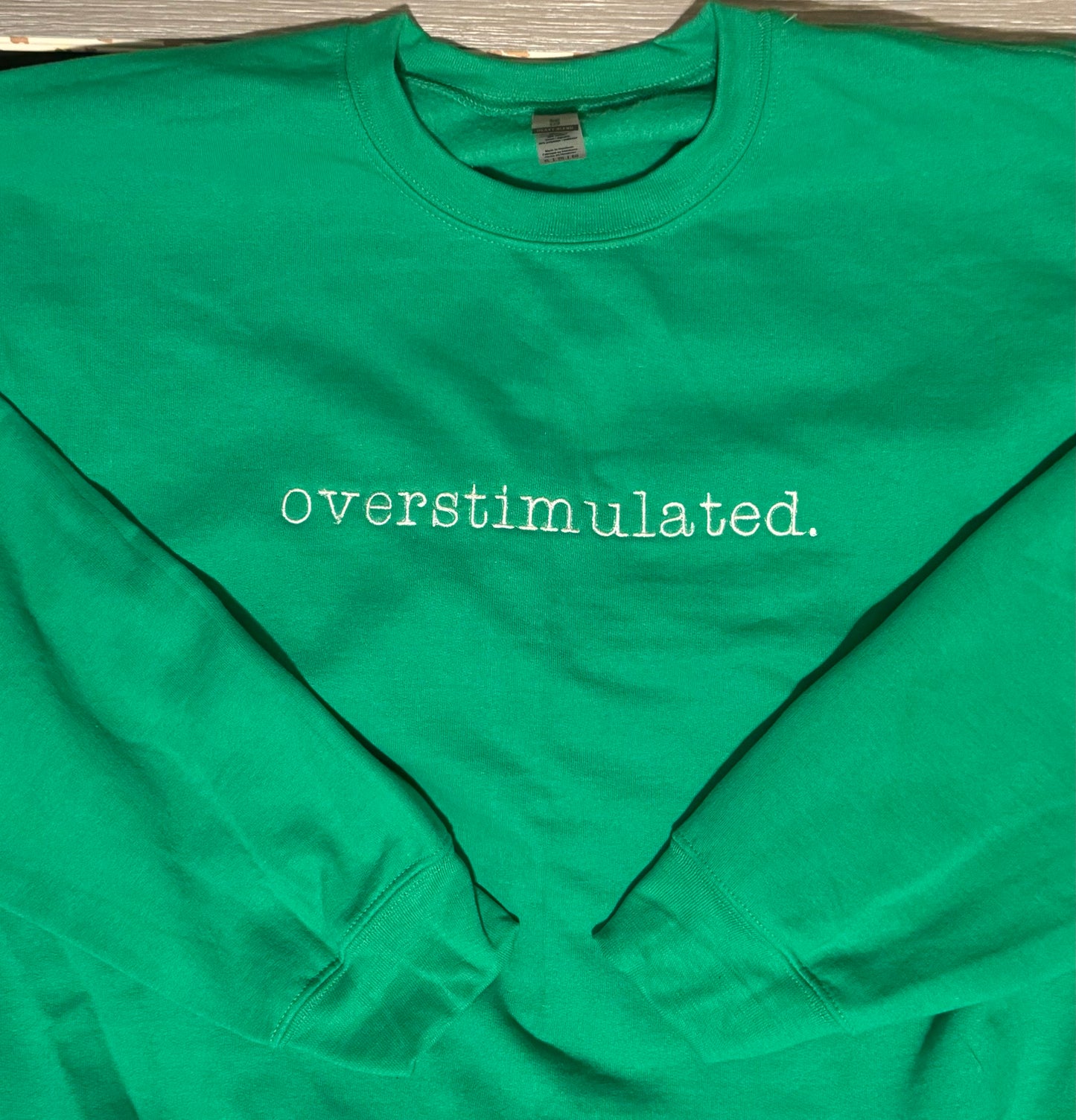 overstimulted. crew sweatshirt Embroidered Funny quote