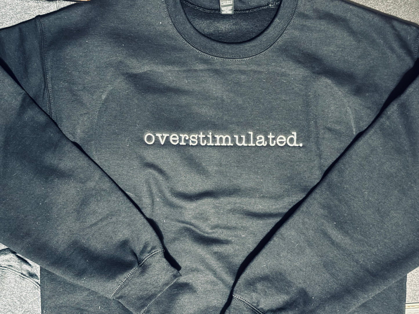 overstimulted. crew sweatshirt Embroidered Funny quote